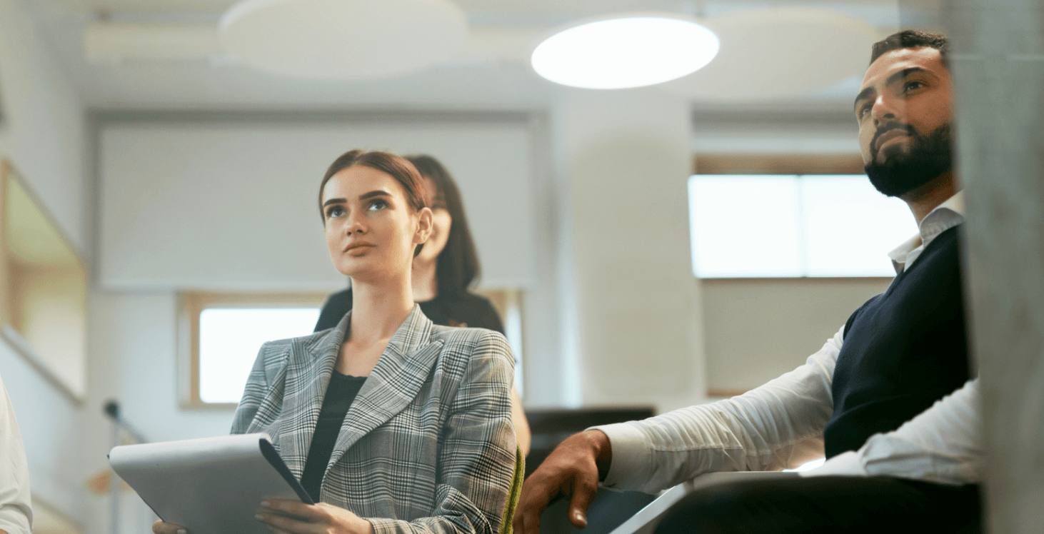 People listening to a presentation