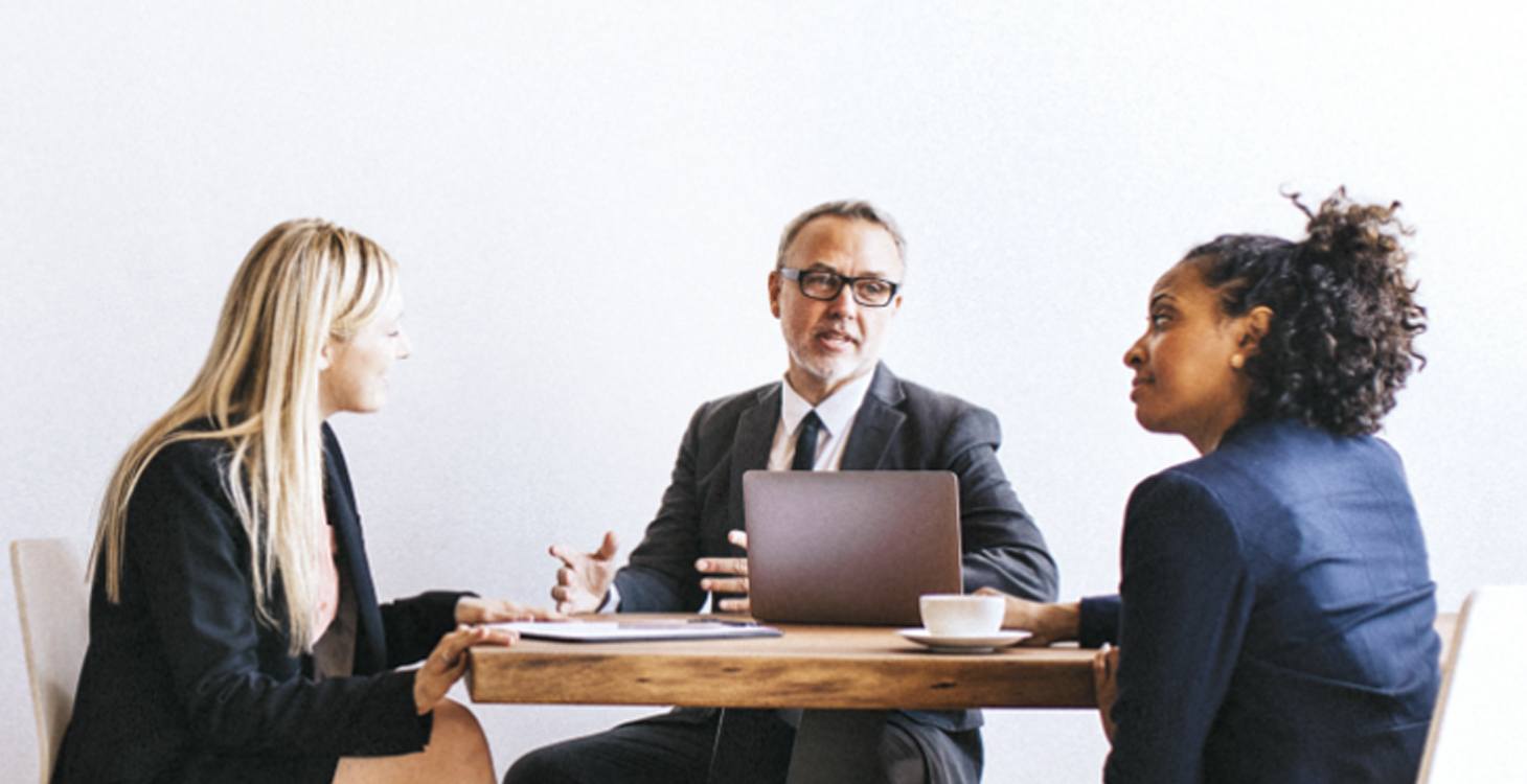 People sitting around a desk